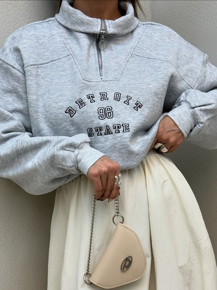 Urban Zip-Collar Embroidered Top